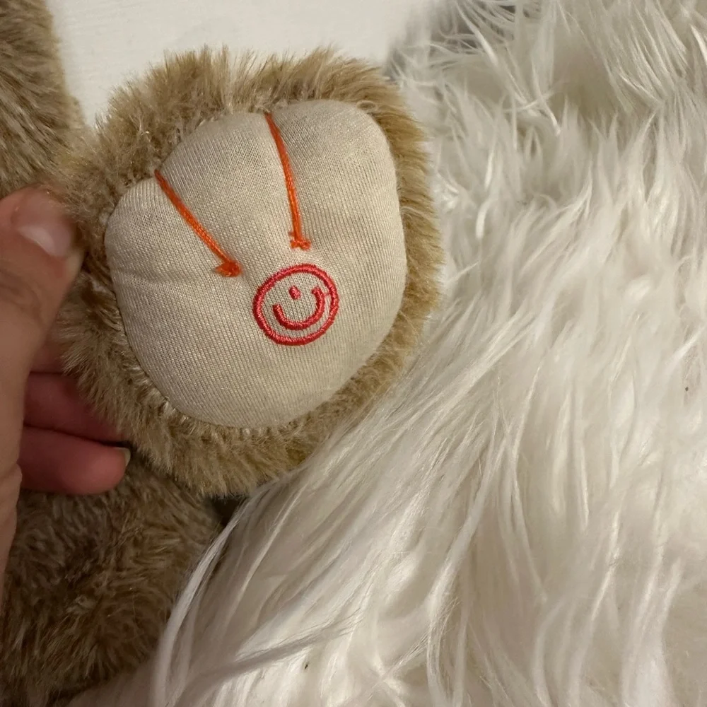 Demdaco Brown and White Plush Dog Toy with Fluffy Fur